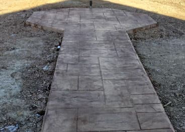 Stamped concrete walkway with flagstone pattern leading to a front door in Summertown, TN